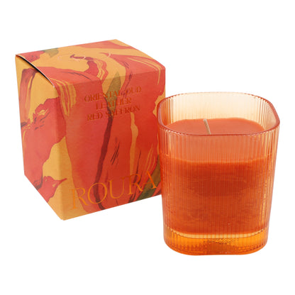 Vela perfumada Oriental Oud en vaso rayado naranja 9x8 cm Roura